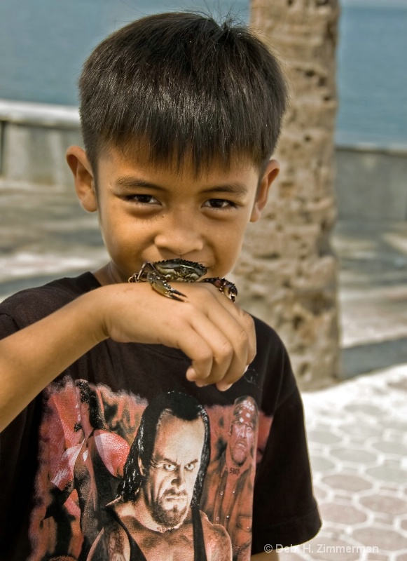 Boy with pet crab on Bay walk