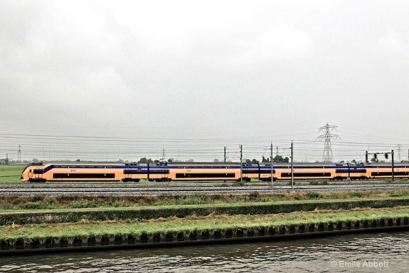 Commuter train along side of Kanaal