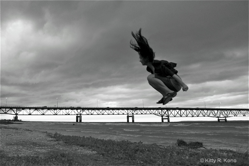 Yumiko Jumping Over the Mackinaw Island Bridge