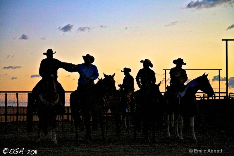 "Cowboys horsing around at the break of day