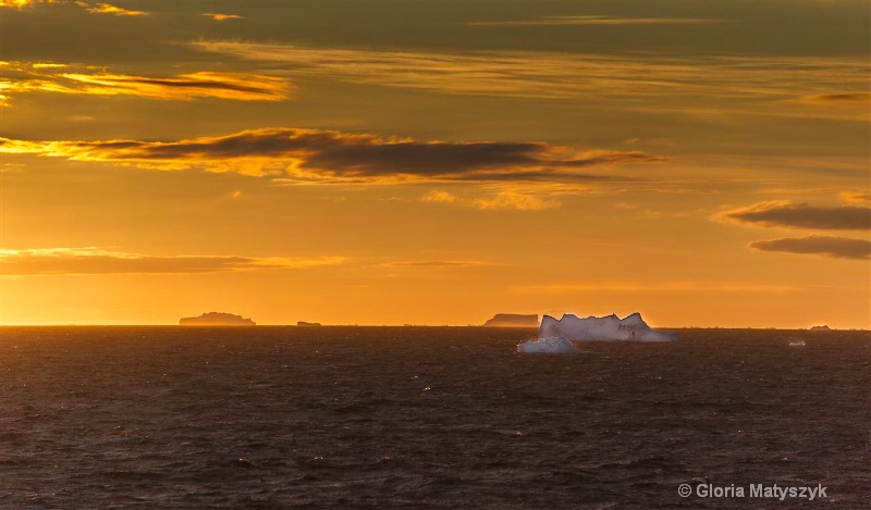 Sunset and iceburgs in Antarctica