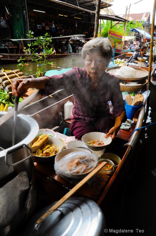 Lady cooking @ Floating Market, Bangkok Thailand 