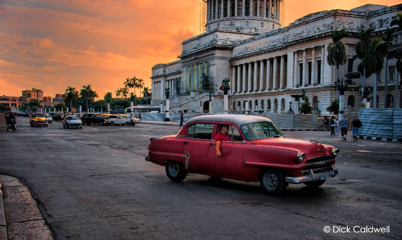 Cars with the Capital building in the background