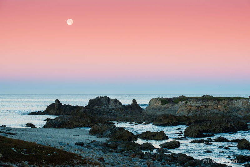 The moon sets in Pacific Grove, CA