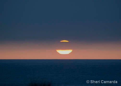 Sun Setting On The Beach