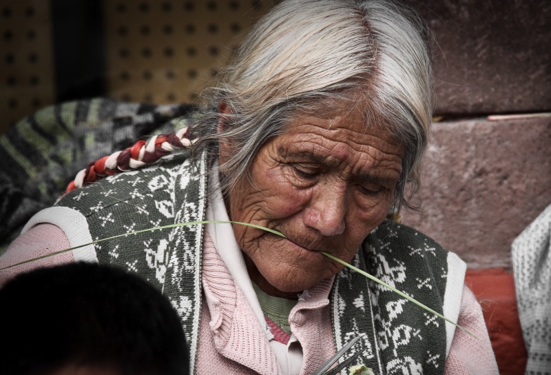 Old Woman Weaving