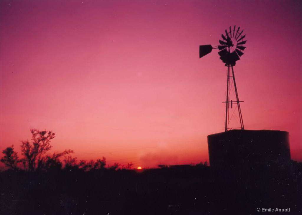 Texas tank and Windmill at sundown