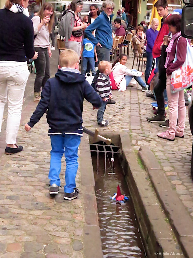 Boy and sailboat in Freiburg