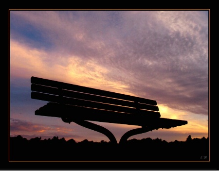 against  the sky-a bench 
