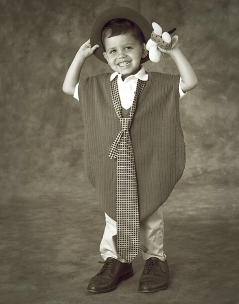 Boy In Big Clothes - Holding Hat