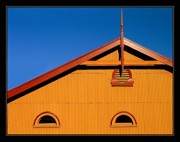 a yellow tin house