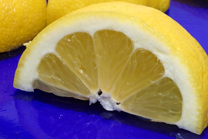 Lemon Wedge on Blue Plate