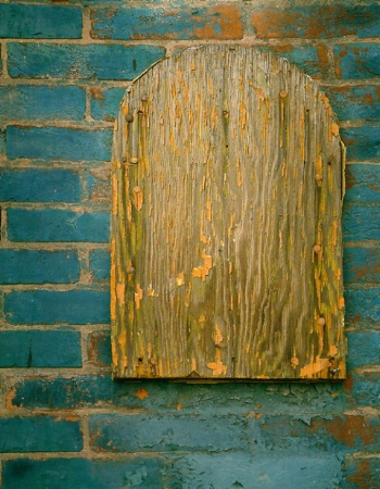 Old Wood on Painted Brick