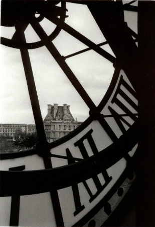 View of the Louvre through Musee D'Orsay cloc