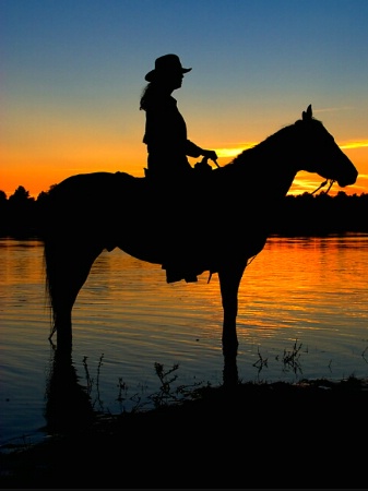 Cowgirl Silhouette at Sunset 