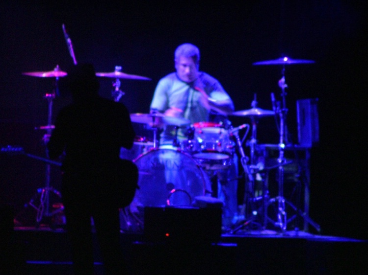 Drummer in Spotlight, Not in Focus