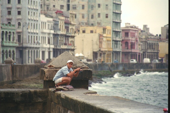 Cuban Boy Fishing on Sea Wall