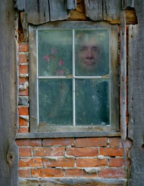 Self Portrait in Barn Window