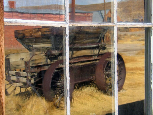 Old Wagon reflected in Window