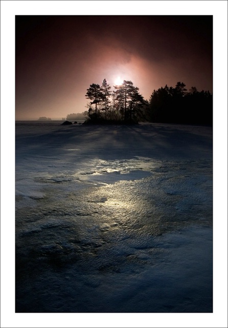 Light over the frozen lake