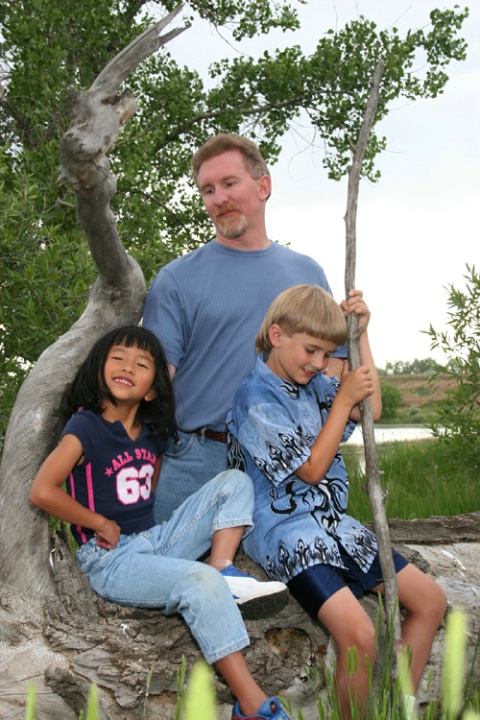 family on a log