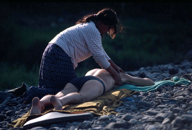Balinese lady massages man on the stoney beach - ID: 2519821 © al armiger