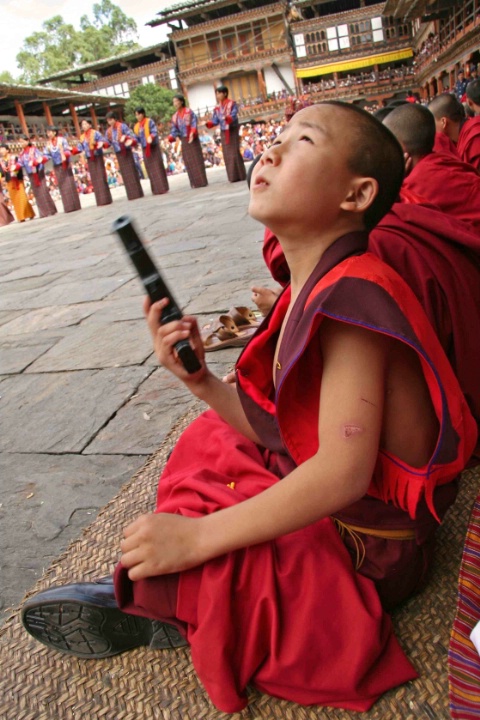 Young monk with gun