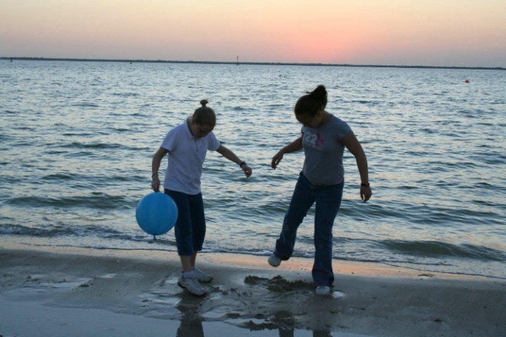 Playing at dusk on the beach