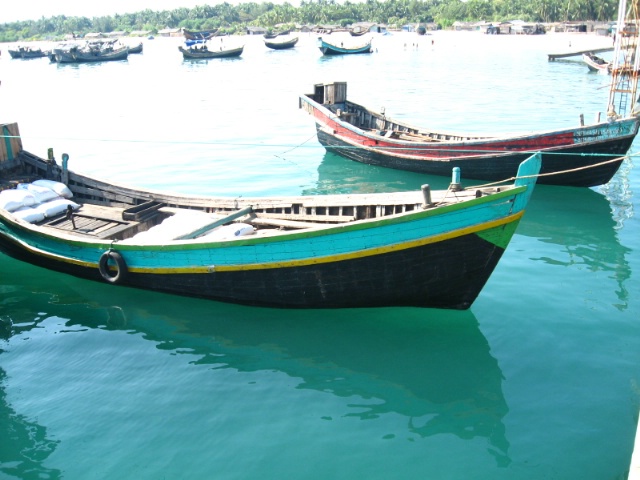 Floating Boats on Crystal Clear Water