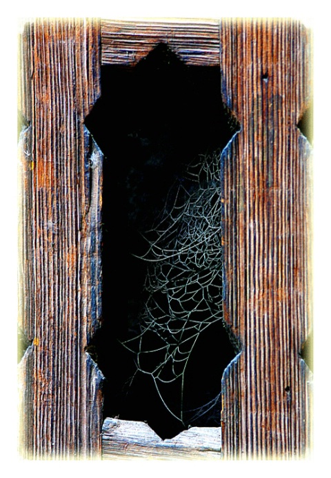 wooden motif in basement window