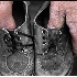 © Sheila Babbie PhotoID # 3463769: Dad Holding Baby Shoes