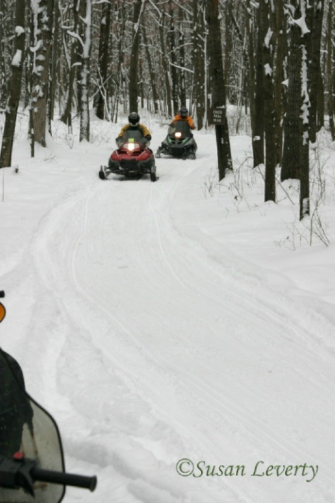 snowmobile trail with  sleds #2