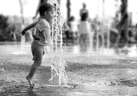 Child plays with water