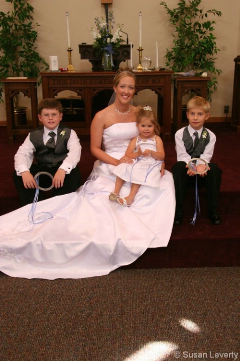Bride with young boys from the wedding Party