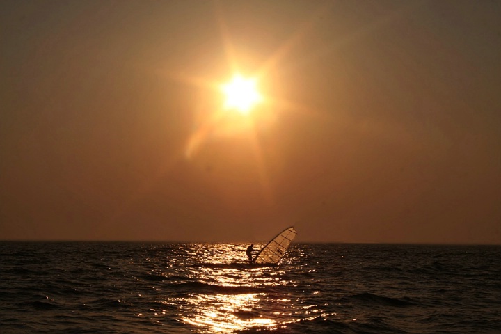 Windsurfer At Sunset