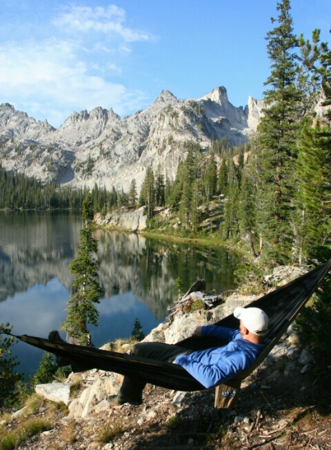 Cole relaxing in front of the beauty of Alice Lake