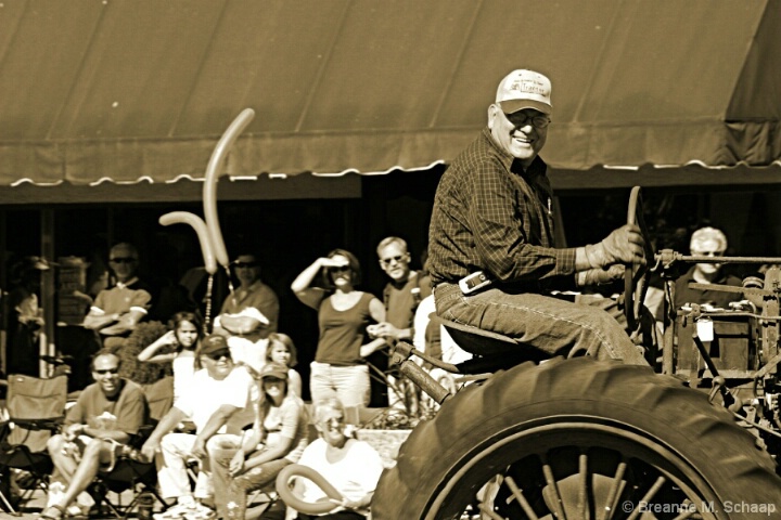 man_on_old_truck_sepia