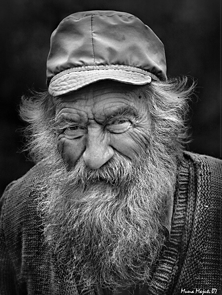 Face of an old, black and white man