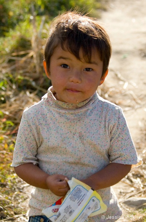 Bhutanese Boy with Potato Chips - ID: 5336255 © Jessica Boklan