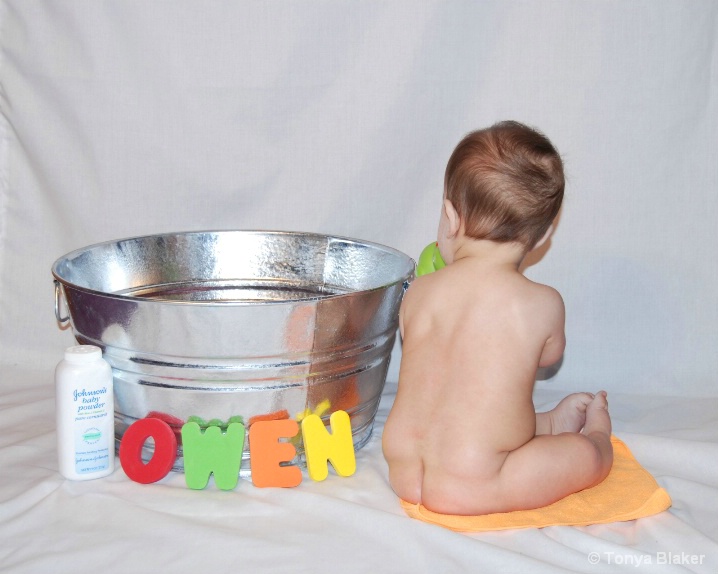 Owen 6 months beside tub