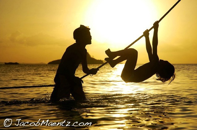 Two boys playing in ocean