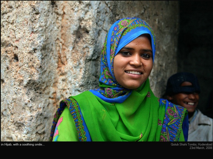 in Hijab, with a soothing smile...