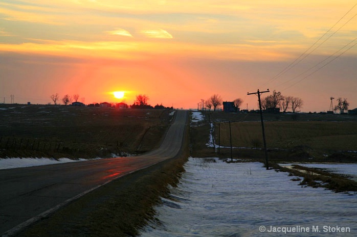 Winter sunset over the Iowa roadway