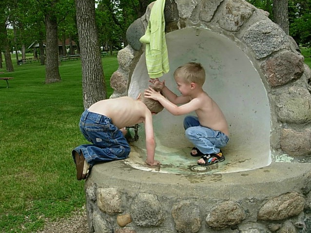 Brothers in a fountain