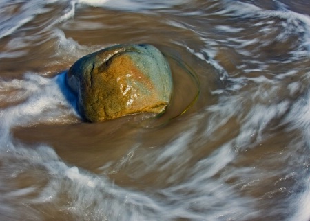 rock in the surf-horizontal image