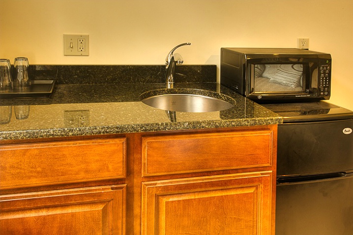 Granite top bar sink with fridge and microwave