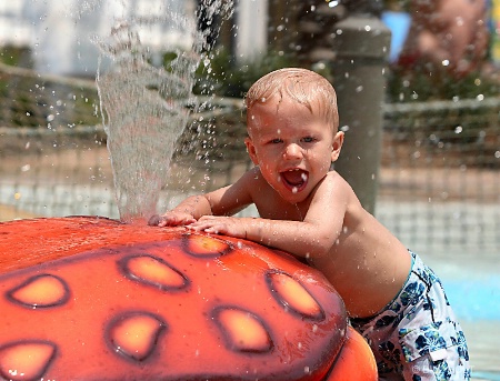 water boy looking into camera and smiling