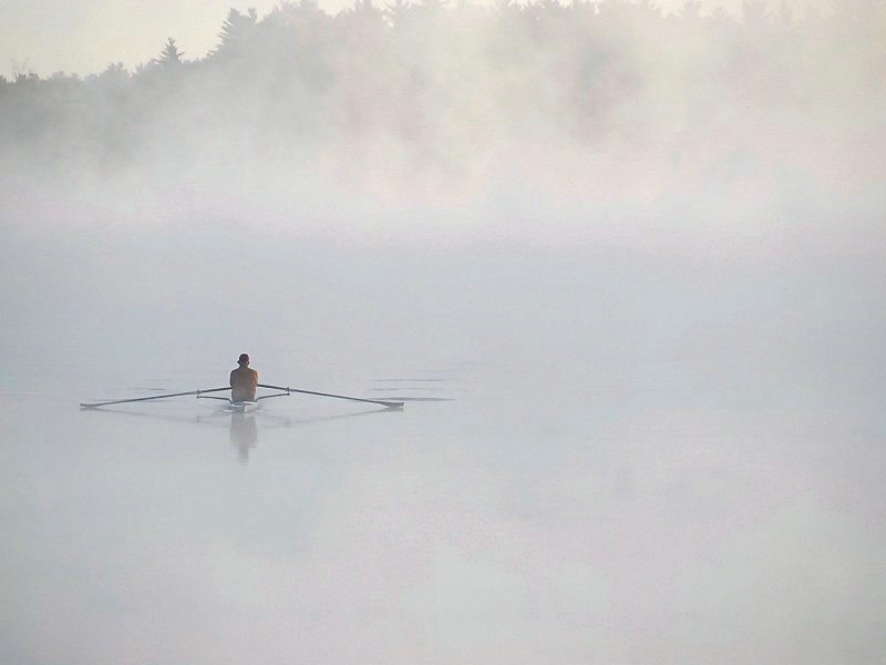 Kayaker in the morning fog