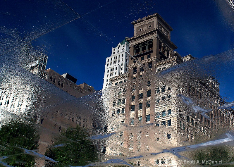 Right Side Down - A reflection on wet pavement 