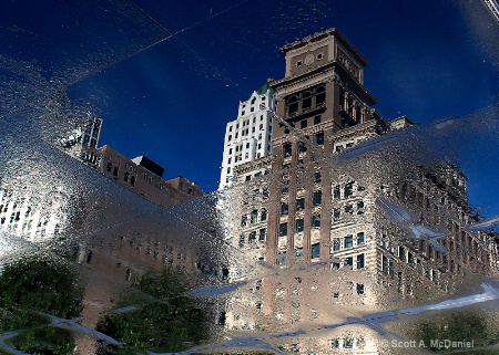 Right Side Down - A reflection on wet pavement 